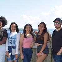 Students and Program Advisor, Hector, taking a picture on top of Fort Mackinac